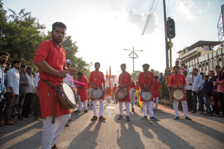 AMRAVATI, MAHARASHTRA, INDIA - 27 SEPTEMBER 2018: Unidentified faithful people carrying Hindu God Ganesha for immersion near water bodies during Ganesha festival. Annual festival.のeditorial素材