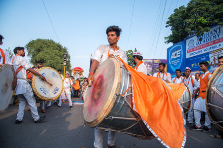 AMRAVATI, MAHARASHTRA, INDIA - 27 SEPTEMBER 2018: Unidentified faithful people carrying Hindu God...