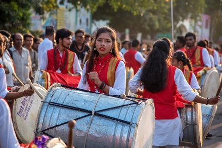 AMRAVATI, MAHARASHTRA, INDIA - 27 SEPTEMBER 2018: Unidentified faithful people carrying Hindu God...
