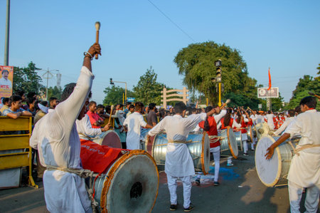 AMRAVATI, MAHARASHTRA, INDIA - 27 SEPTEMBER 2018: Unidentified faithful people carrying Hindu God...