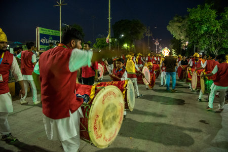 AMRAVATI, MAHARASHTRA, INDIA - 27 SEPTEMBER 2018: Unidentified faithful people carrying Hindu God...