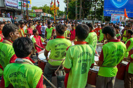 AMRAVATI, MAHARASHTRA, INDIA - 27 SEPTEMBER 2018: Unidentified faithful people carrying Hindu God...