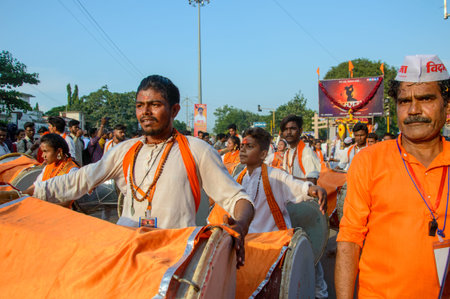 AMRAVATI, MAHARASHTRA, INDIA - 27 SEPTEMBER 2018: Unidentified faithful people carrying Hindu God...