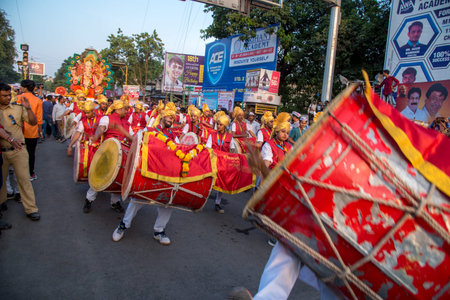 AMRAVATI, MAHARASHTRA, INDIA - 27 SEPTEMBER 2018: Unidentified faithful people carrying Hindu God...