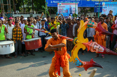 AMRAVATI, MAHARASHTRA, INDIA - 27 SEPTEMBER 2018: A man performing with heavy Trishul (Trident) in...