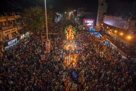 AMRAVATI, MAHARASHTRA, INDIA - 27 SEPTEMBER 2018: Crowd of unidentified people carrying Hindu God...