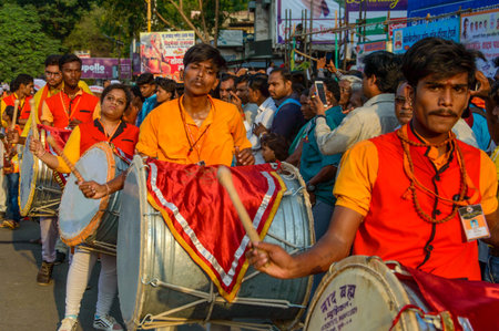 AMRAVATI, MAHARASHTRA, INDIA - 27 SEPTEMBER 2018: Crowd of unidentified people carrying Hindu God...