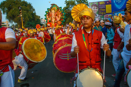 AMRAVATI, MAHARASHTRA, INDIA - 27 SEPTEMBER 2018: Crowd of unidentified people carrying Hindu God...