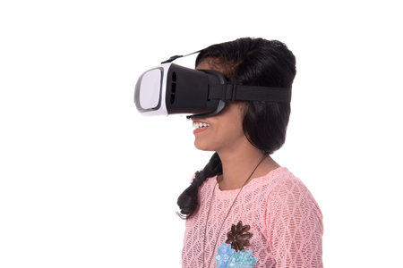 Indian young girl looking though VR device, 3D Virtual Reality Glasses headset, Girl with Modern...