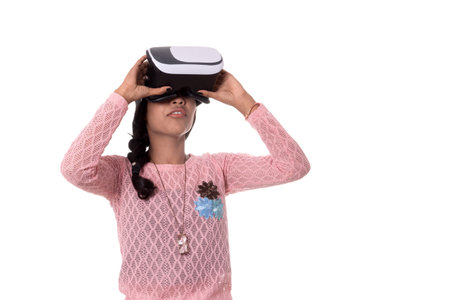 Indian young girl looking though VR device, 3D Virtual Reality Glasses headset, Girl with Modern...