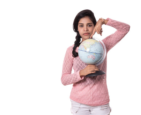 Beautiful Girl holding a world globe isolated on a white backgroundの写真素材