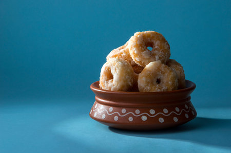 Indian Traditional Sweet Food Balushahi on a blue background