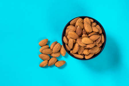 Close-up of Almonds on blue backgroundの写真素材