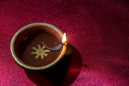 Clay diya lamps lit during Diwali Celebration. Greetings Card Design Indian Hindu Light Festival...