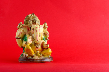 Hindu God Ganesha. Ganesha Idol on red Background.の写真素材