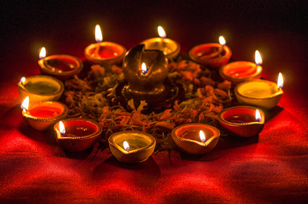 Clay diya lamps lit during Diwali Celebration. Greetings Card Design Indian Hindu Light Festival...