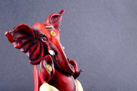 Hindu God Ganesha. Ganesha Idol on grey Background.の写真素材