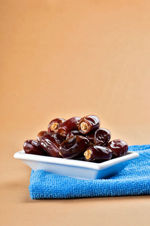 Dates in plate. Dried dates fruits.