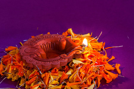 Clay diya lamps lit during Diwali Celebration. Greetings Card Design Indian Hindu Light Festival...