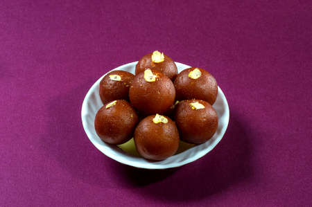 Indian Dessert : Gulab Jamun in white bowlの写真素材