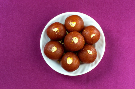 Indian Dessert : Gulab Jamun in white bowl