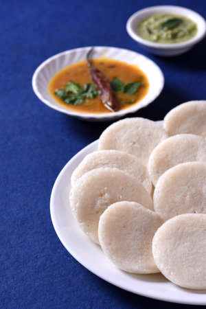 Idli with Sambar and coconut chutney on blue background, Indian Dish : south Indian favourite food...