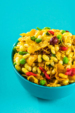 Indian Snacks: Traditional Indian deep fried salty dish called chivda or mixture or farsan made of...