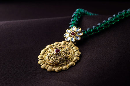 Indian Traditional Jewellery, close up of pendent on dark background