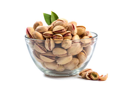 Pistachios in Glass Bowl on white backgroundの写真素材
