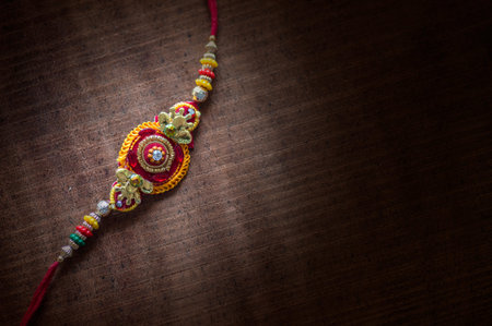 Raksha Bandhan background with an elegant Rakhi. A traditional Indian wrist band which is a symbol of love between Brothers and Sisters.の写真素材