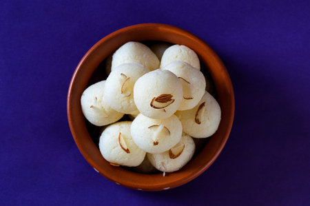 ndian Sweet or Dessert - Rasgulla in clay pot