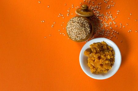 Sesame Seeds in clay pot with Jaggery in bowl