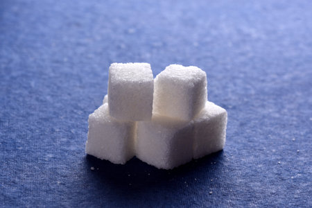 Close-up of Sugar Cubes on Blue Background