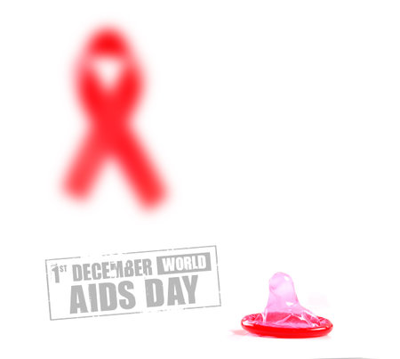 Aids ribbon and condom on white background.