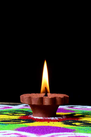 Clay diya lamps lit during diwali celebration. Greetings Card Design Indian Hindu Light Festival called Diwaliの写真素材