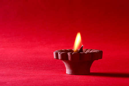 Clay diya lamps lit during diwali celebration. Greetings Card Design Indian Hindu Light Festival called Diwaliの写真素材
