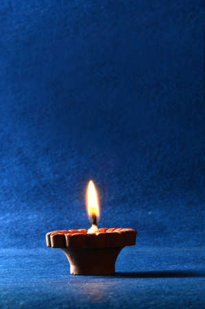 Clay diya lamps lit during diwali celebration. Greetings Card Design Indian Hindu Light Festival called Diwaliの写真素材