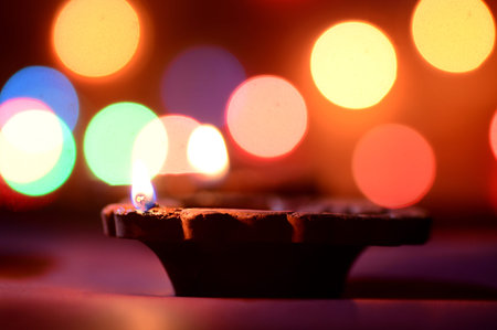 Clay diya lamps lit during Diwali Celebration. Greetings Card Design Indian Hindu Light Festival...