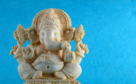 Hindu God Ganesha. Ganesha Idol on blue backgroundの写真素材