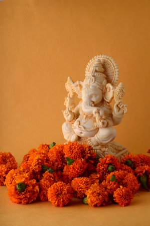 Hindu God Ganesha. Ganesha Idol on yellow backgroundの写真素材