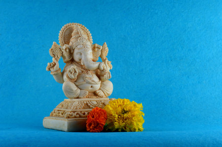 Hindu God Ganesha. Ganesha Idol on blue background