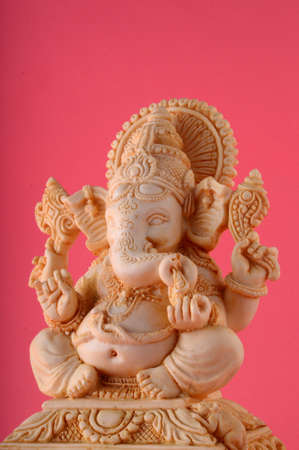 Hindu God Ganesha. Ganesha Idol on pink backgroundの写真素材