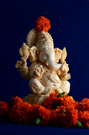 Hindu God Ganesha. Ganesha Idol on blue backgroundの写真素材
