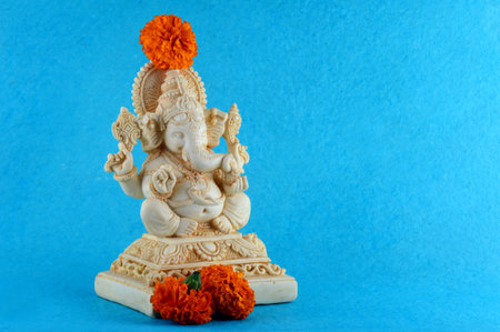 Hindu God Ganesha. Ganesha Idol on blue backgroundの写真素材