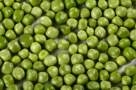 Fresh Green Pea in white plate on white backgroundの写真素材