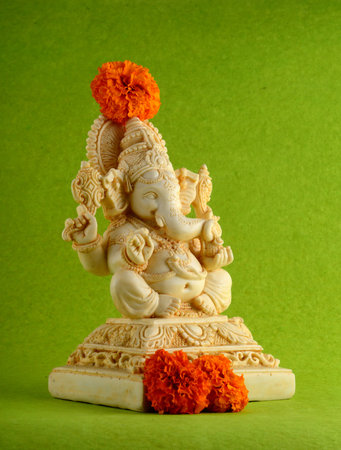 Hindu God Ganesha. Ganesha Idol on green backgroundの写真素材