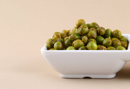 Spiced fried green peas {chatpata matar} Indian snack. Dried salted green peasの写真素材