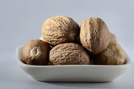 Close up of Nutmeg in a white plateの写真素材