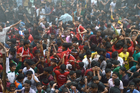 AMRAVATI, MAHARASHTRA, INDIA - AUGUST 29 : Crowd of young People enjoying "Govinda" at Dahi Handi festival to celebrate God Krishna's Birth in Amravati, Maharashtra, India. 29 August 2013のeditorial素材