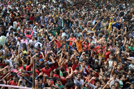 AMRAVATI, MAHARASHTRA, INDIA - AUGUST 29 : Crowd of young People enjoying "Govinda" at Dahi Handi festival to celebrate God Krishna's Birth in Amravati, Maharashtra, India. 29 August 2013のeditorial素材